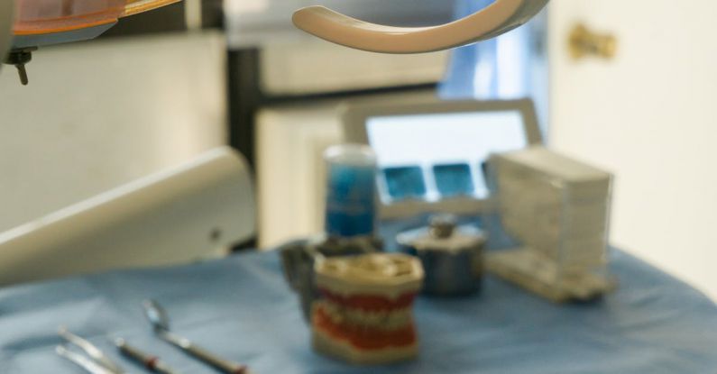 Technology Healthcare - A Lamp and Medical Instruments in a Dental Office