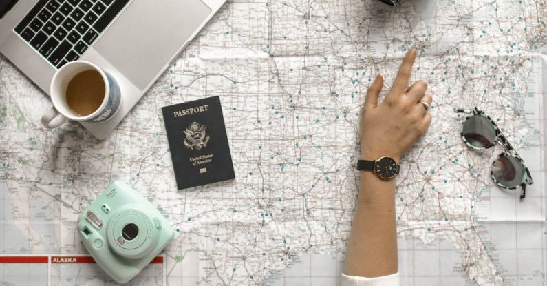 Technology Travel - Person Pointing a Location on the Map