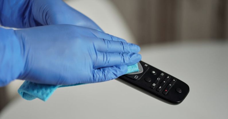 Cleaning Electronics - Person Holding Black Remote Control