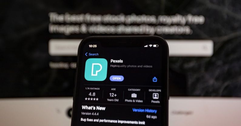 App Permissions - A person holding a smartphone with the app on it
